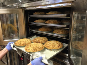 Pies coming out of Oven